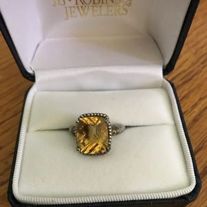 Lab created gold stone with sterling silver band.